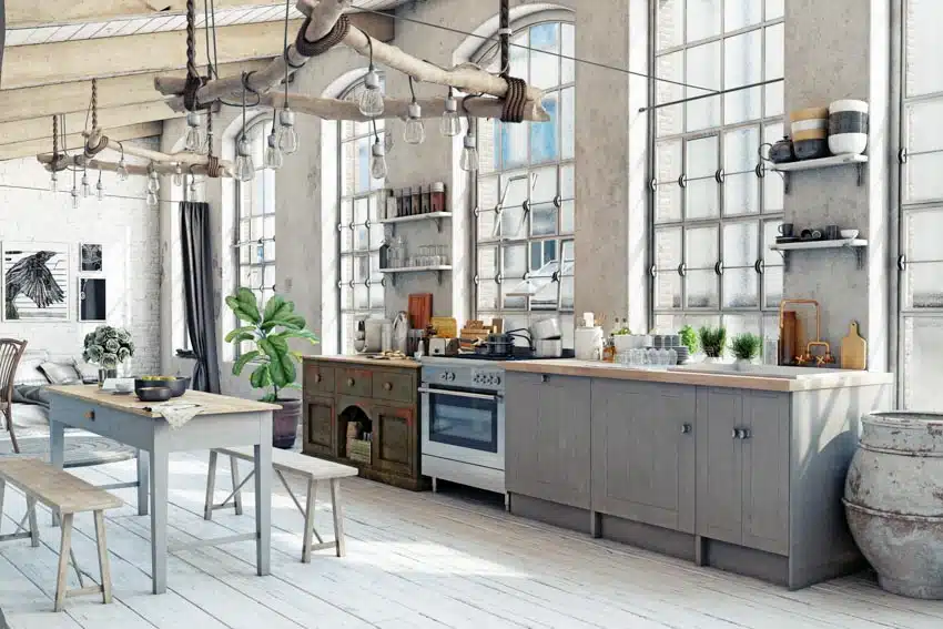 Kitchen With Tablebenches Chandeliers Gray Washed Cabinets Countertop Oven And Windows Ss .webp