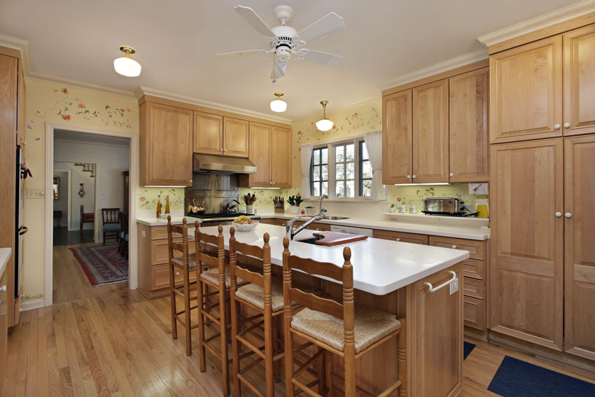 Kitchen with white countertops and wood flooring