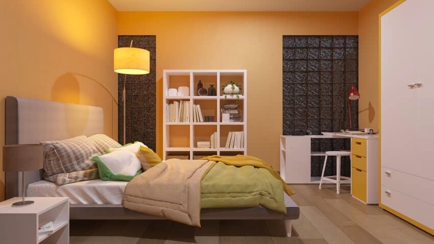 Bedroom in apricot color with glass blocks and book shelves
