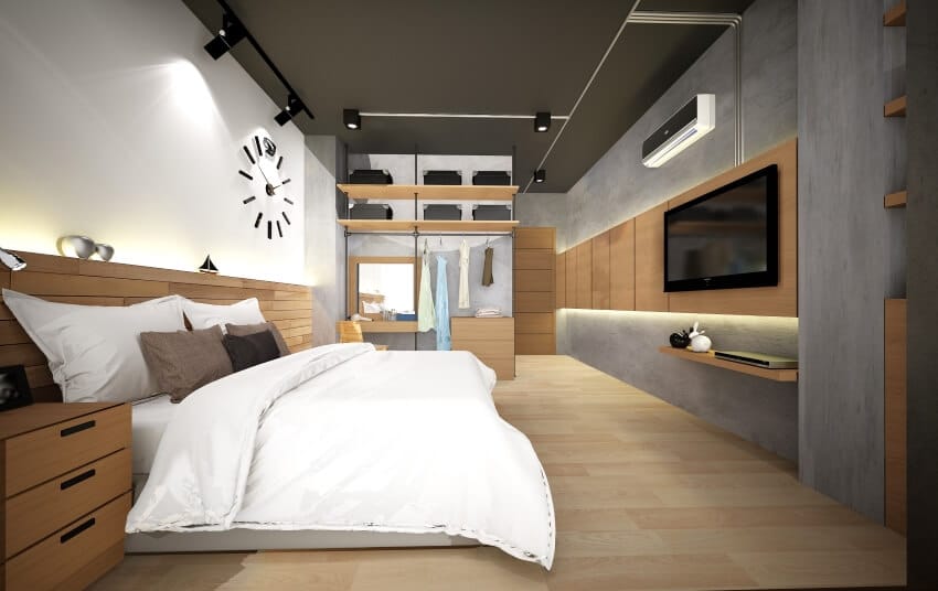 Modern bedroom with brown furniture, track lighting, hardwood floor and concrete wall