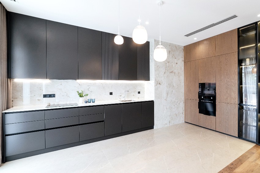 Modern interior design of the kitchen in black pvc over wood cabinets