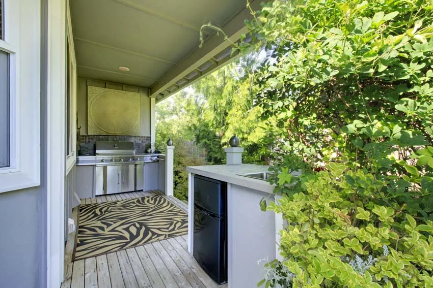 Outdoor kitchen with refrigerator