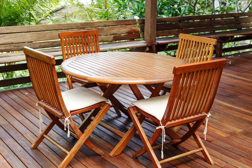 Outdoor patio with teak wood table and chairs