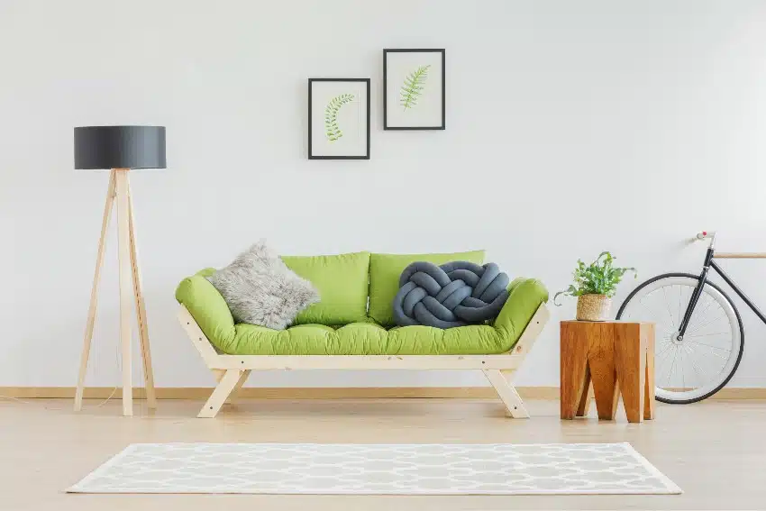 Scandinavian living room with parawood furniture and stool made of oak wood