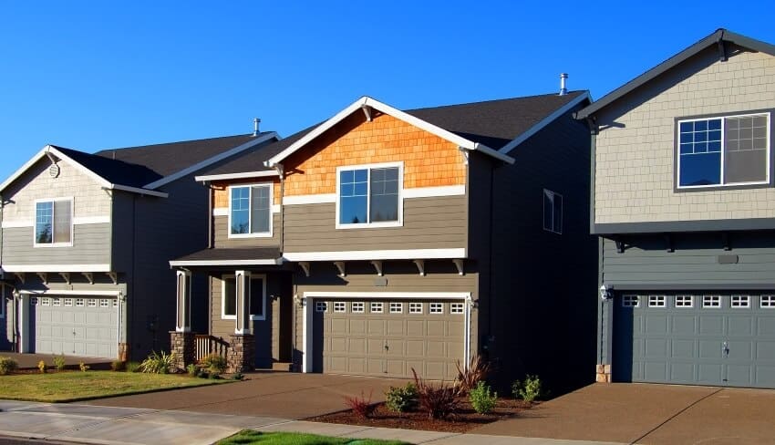 Structurally identical houses with earth tone exterior paints
