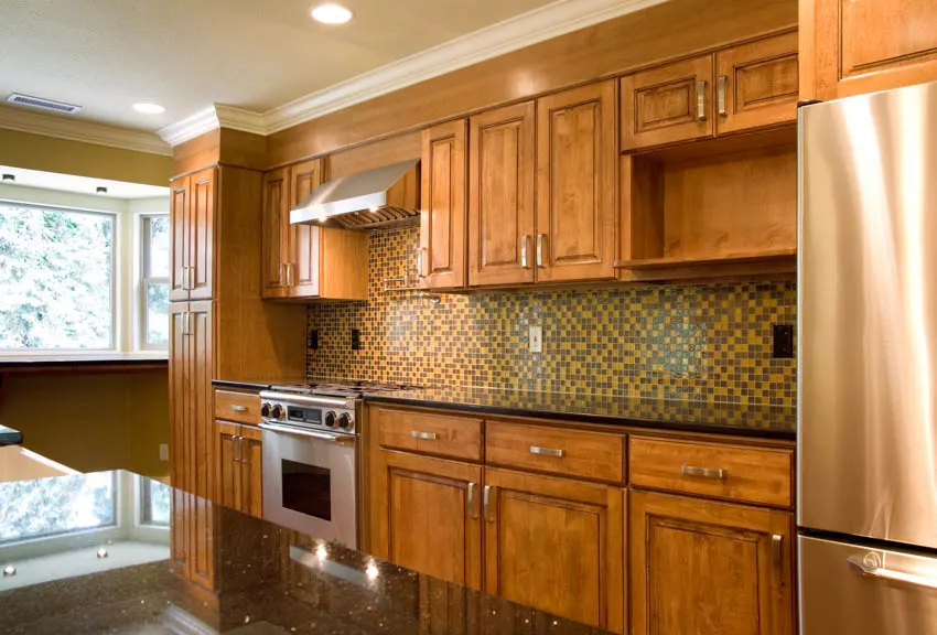 Kitchen with glass pieces arranged on wall