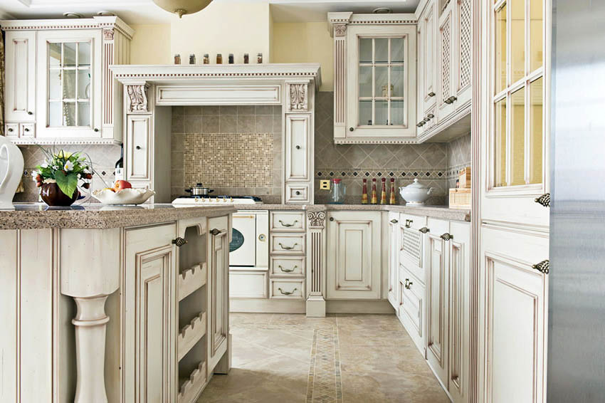 Kitchen with custom antique white cabinets with glass doors