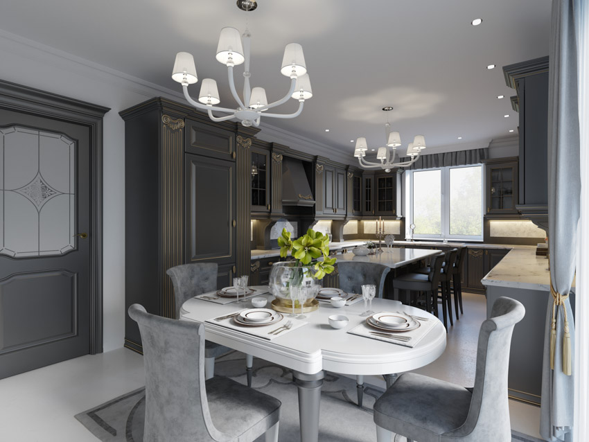 Open layout concept with dining table and chairs, dark brown cabinwets and grey rug