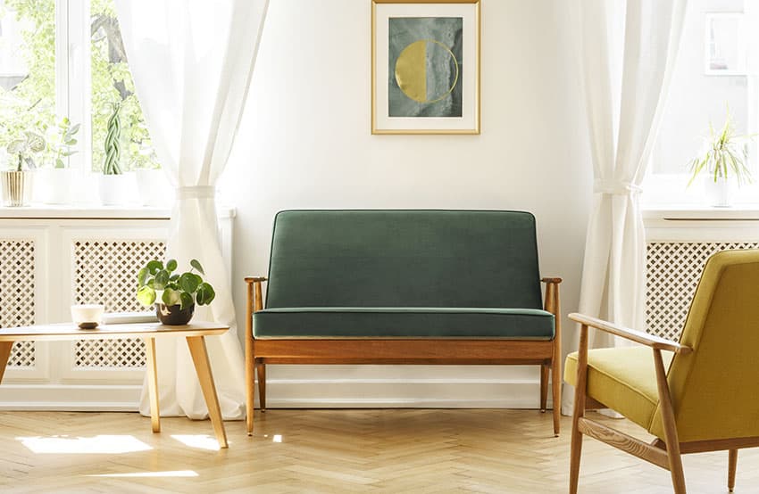 Mid century modern living room with wooden sofa coffee table herringbone floor tile layout