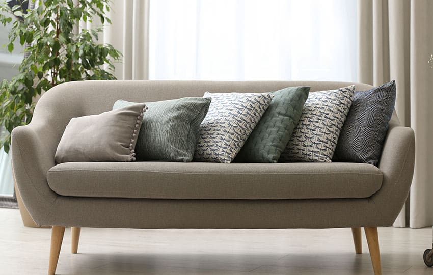 Sofa with different sizes of throw pillows