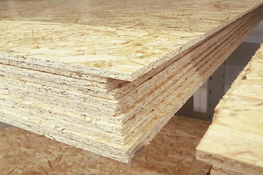 A stack of oriented strand board OSB sheets in the warehouse