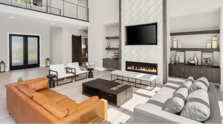 Amazing open floor plan modern living room interior with neutral paint colors, high ceiling, hardwood floors and fireplace