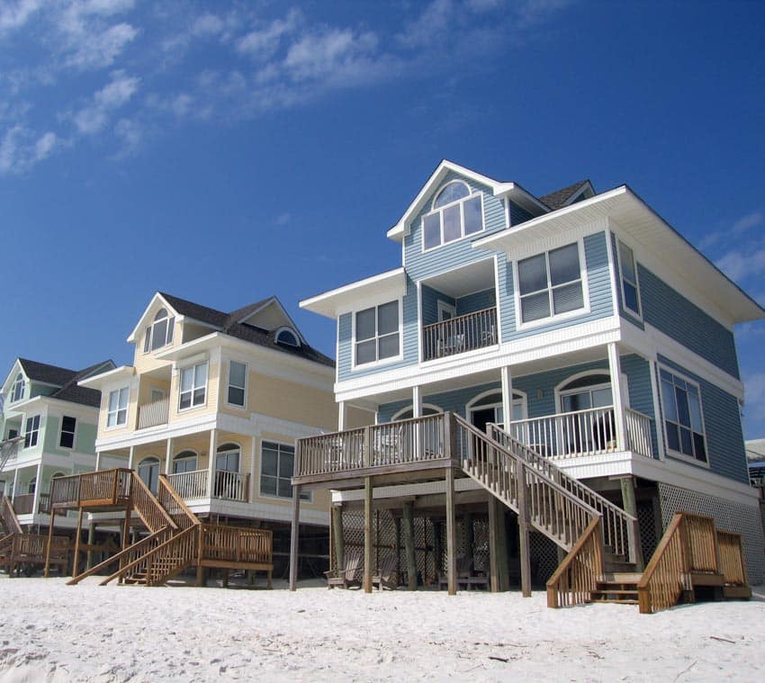 Beach houses with coastal exterior paint colors, windows, front porches, dormers, and front doors
