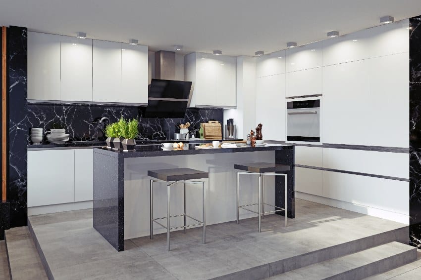 Beautiful black and white kitchen with granite countertops, island with stools and cabinets