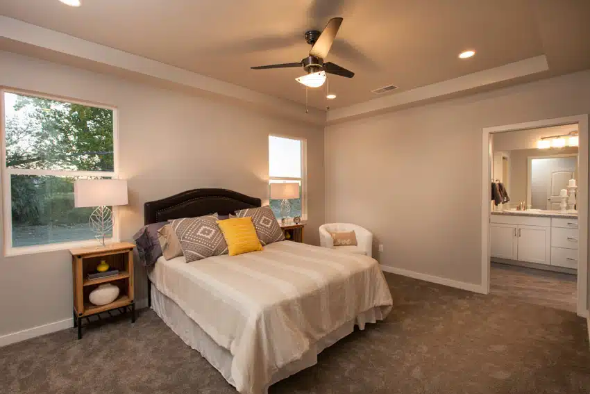 Bedroom with ceiling fan with a dimmer