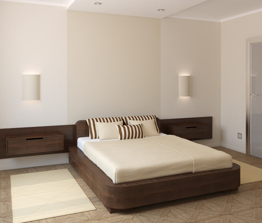 Bedroom with flush mount wall sconces, mattress, pillows, floating nightstand, and ceiling lights