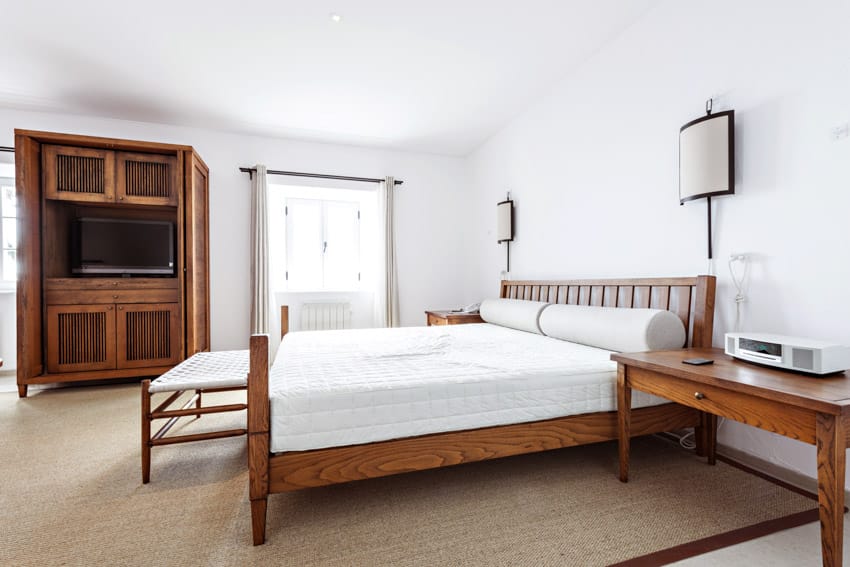 Bedroom with mattress, nightstand and mission style furniture