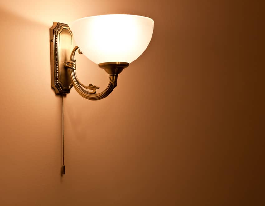 Classic uplight sconce installed on wall for bedrooms