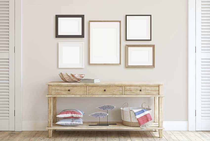 Console table against wall with picture frames