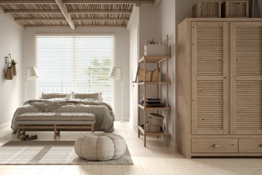 Cozy wooden peaceful bedroom in beige tones with ash wood furniture and window with venetian blinds