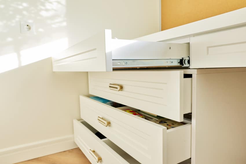 Desk with white drawers, hardware, and side mounted slides