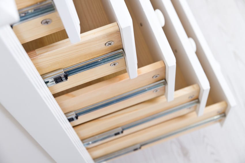Different drawers with side mounted slides