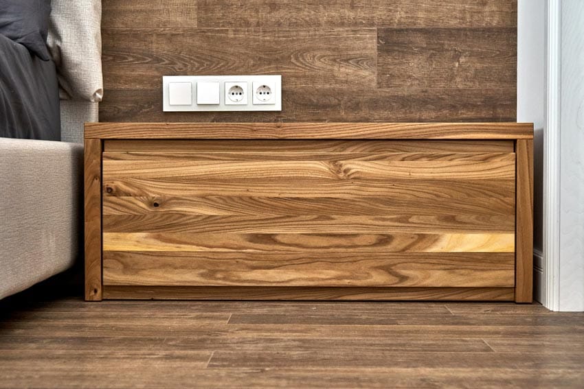 Wooden nightstand with sockets
