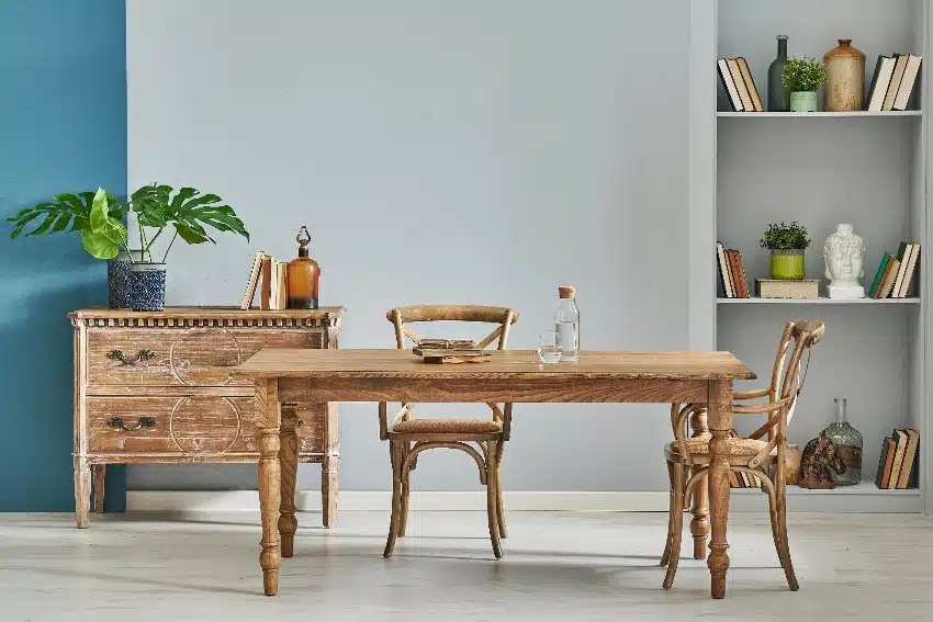 Home office with long table, chairs and weathered look console table