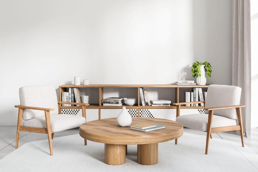 Light interior with wooden chairs, table and cabinet with decorations