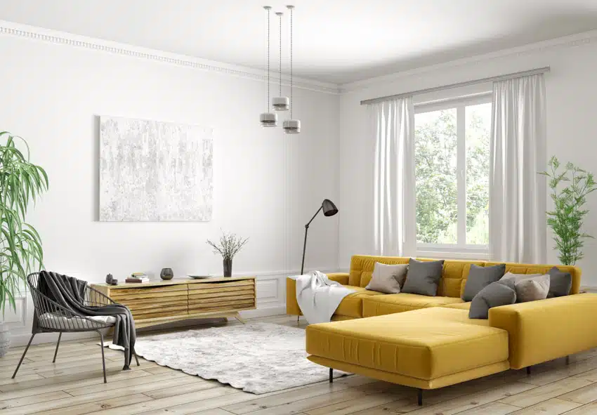Minimalist living room with white walls, white curtains, yellow sofa, console table, floor lamp, accent chair, rug, indoor plants, and pendant lights
