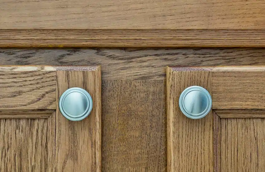 Cabinets made of wood with round metal handles
