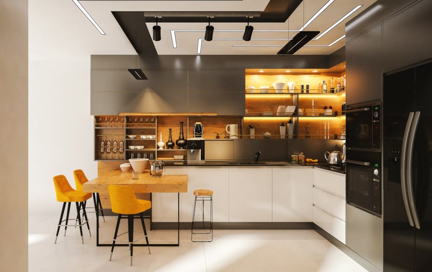 Modern kitchen with table, chairs, copper backsplash, shelves, countertop, oven, refrigerator, and track lighting