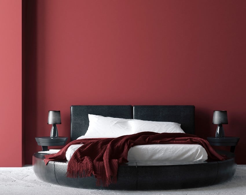 A modern luxury red brown bedroom interior with black round bed