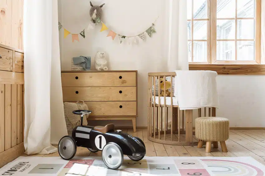 Nursery with rubberwood, chest of drawers. accent chair and hassock