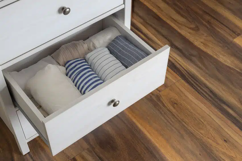 Different towels inside an open drawer 
