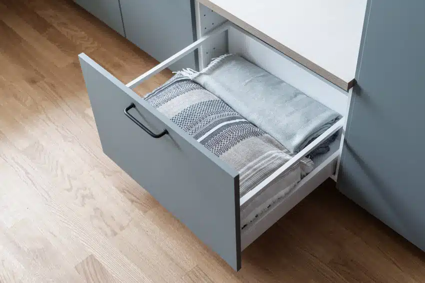 Bottom drawer filled with fabric