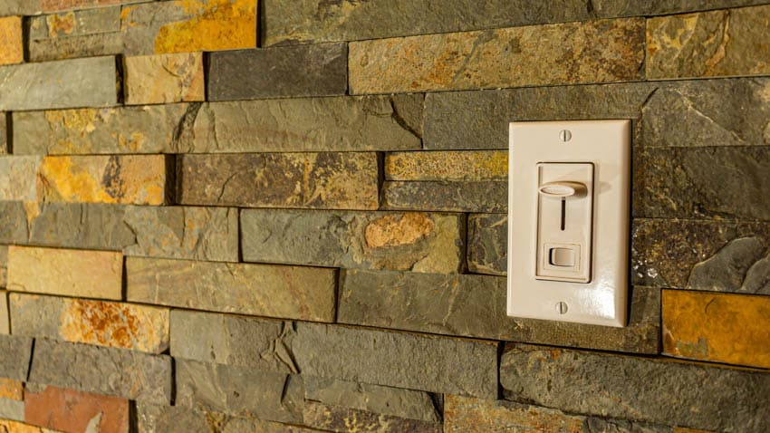 Slide dimmer on brick wall