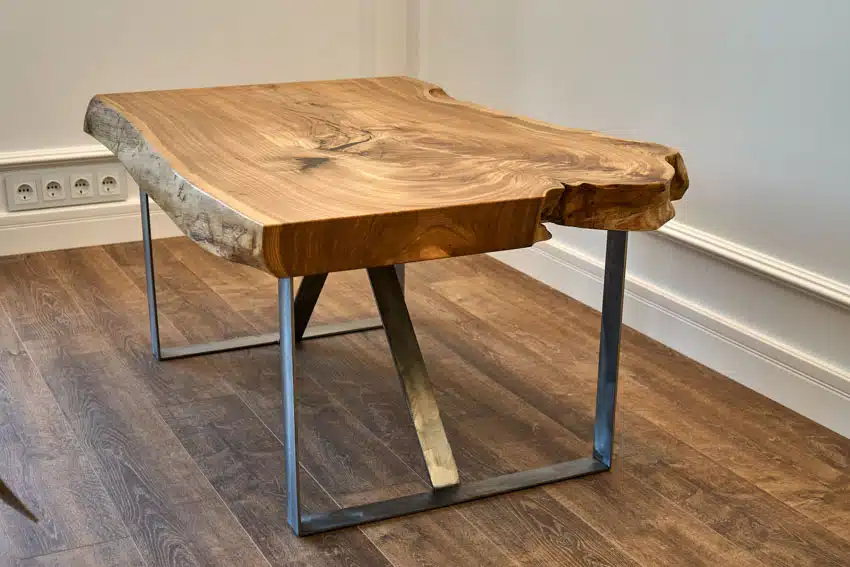 Table made of a bookmatch wood slab with metal legs