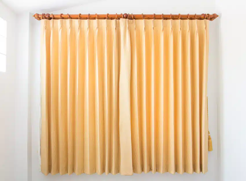 Traditional curtain panels attached to a rod 