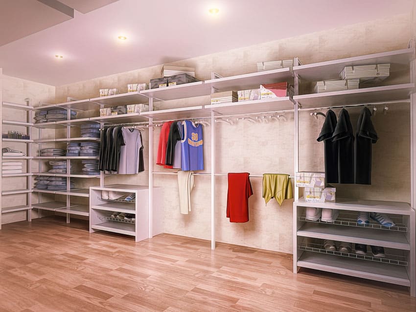 Walk-in closet with shelves, hangers, ceiling lights, and shoe drawers