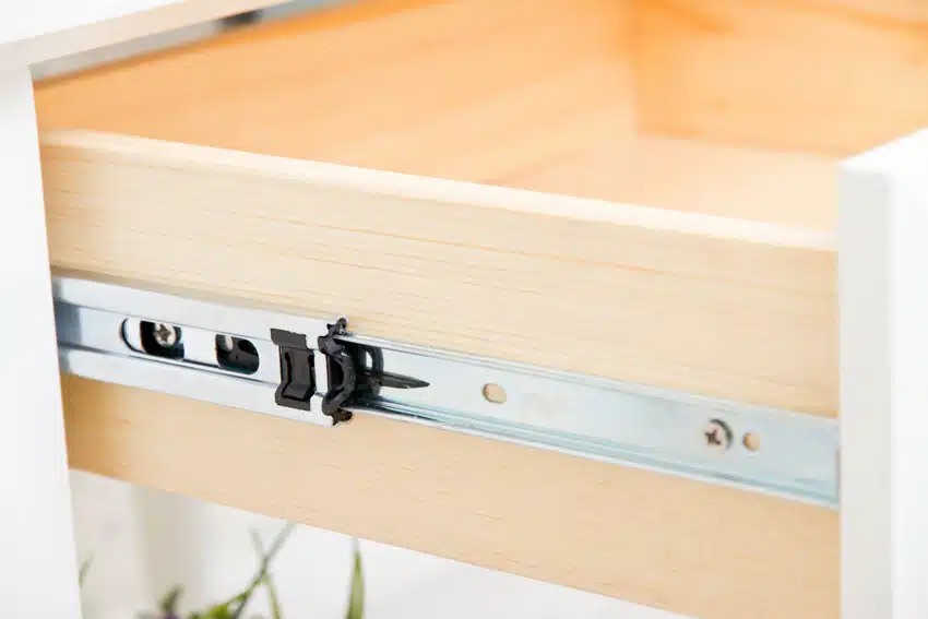 Wooden drawer with roller slides
