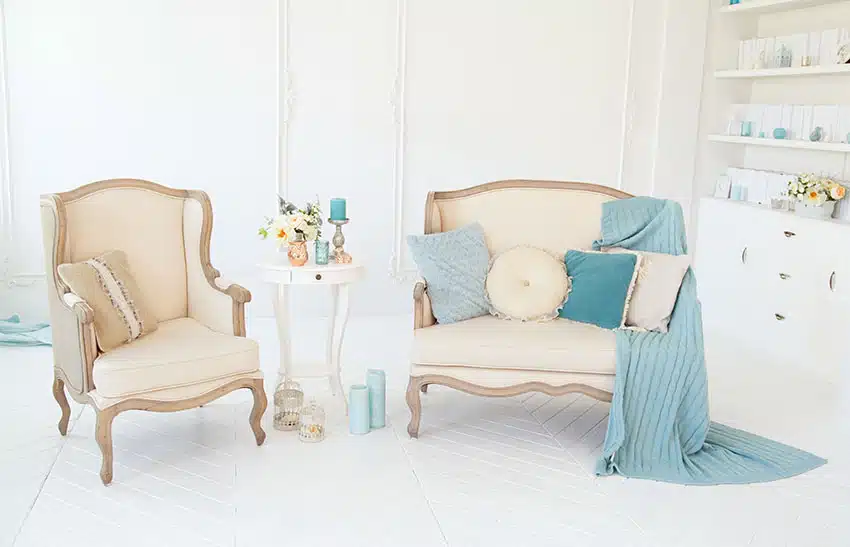 Elegant upholstered armchairs herringbone floor small side table