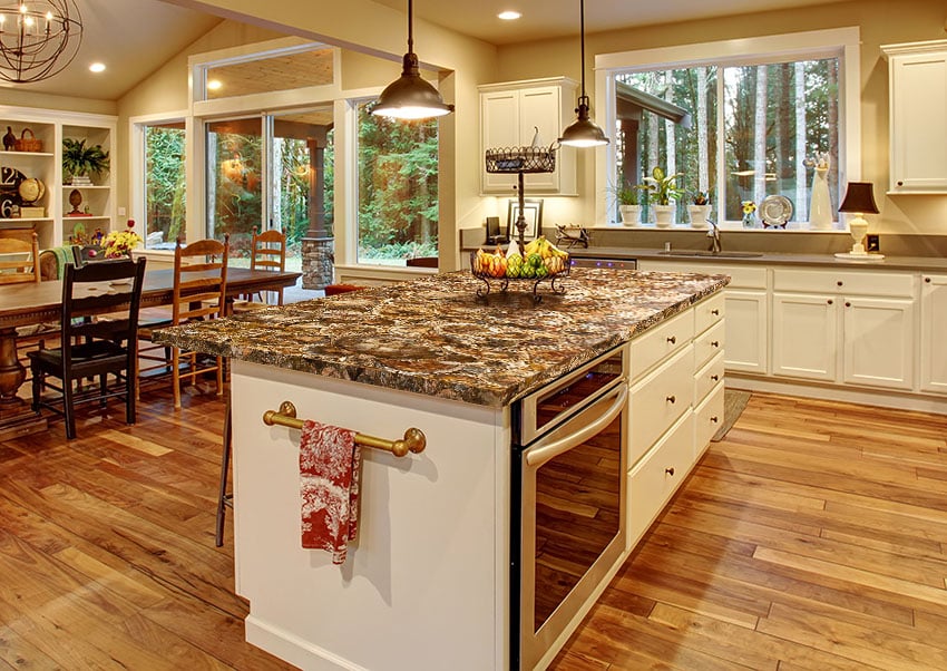 Large kitchen with island and petrified wood surface
