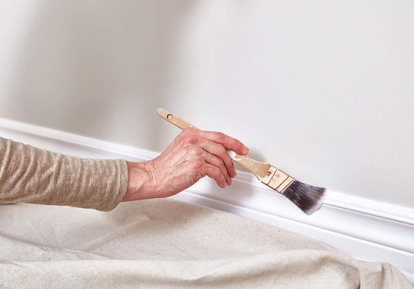 Painting trim with paint brush