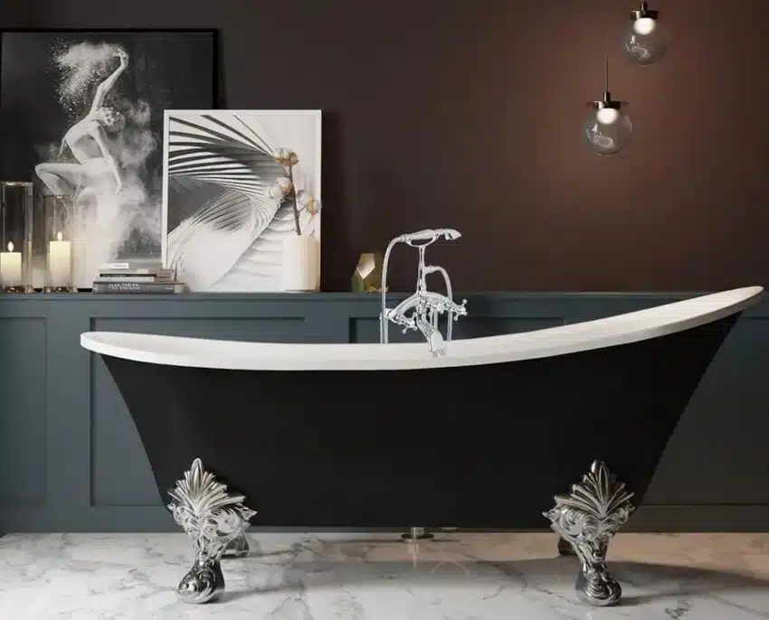 Bathroom with black tub, freestanding faucet, marble floors, and leaf shaped clawfoot tub feet