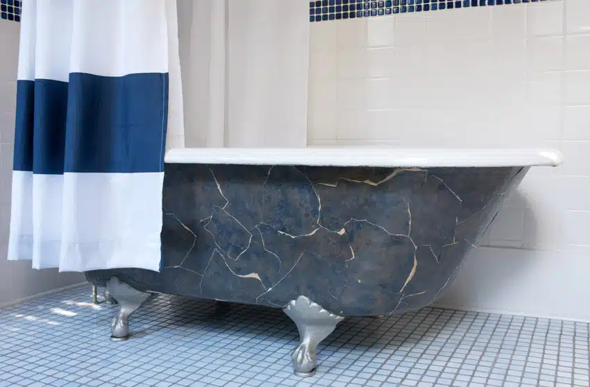 Bathroom with tub, shower curtain, square tile floors, and clawfoot tub feet