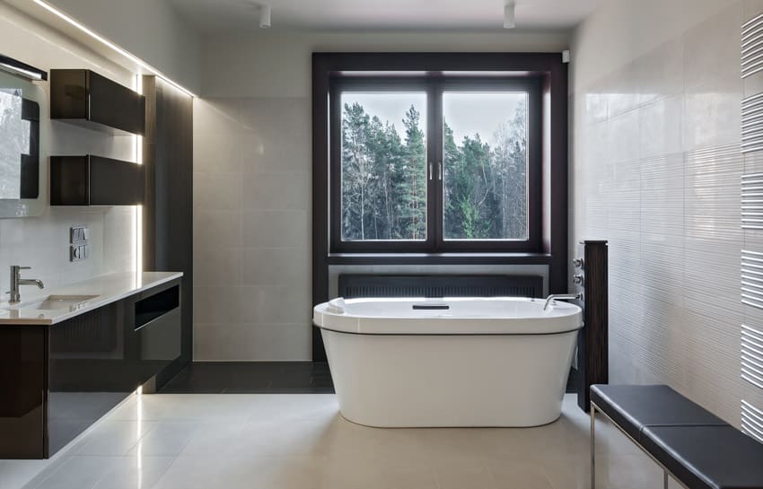 Bathroom with large windows and accent lighting fixtures