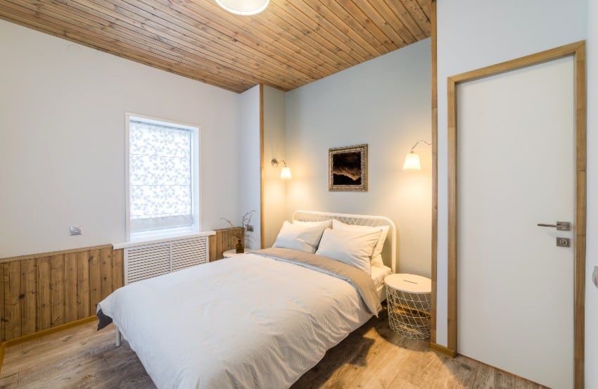Beautiful minimalist white and wood cottage style bedroom interior