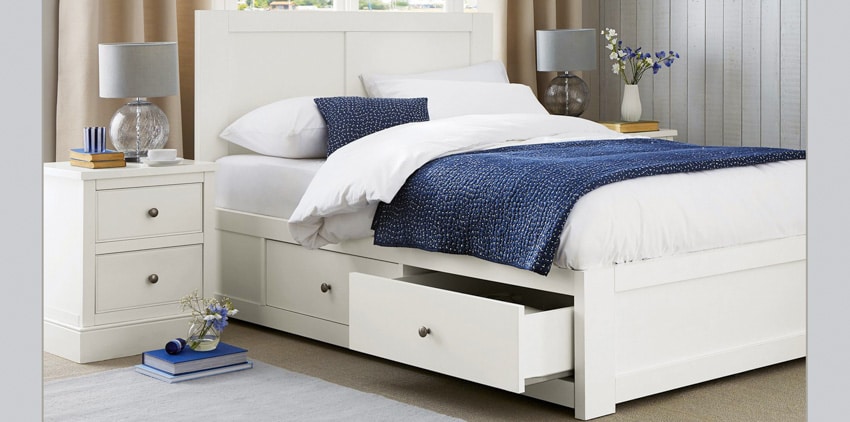 Bedroom with white shaker nightstands, bed frame, headboard, mattress, pillows, and comforter