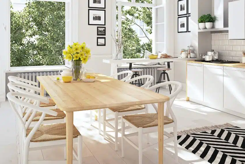 Bright kitchen in white and wood design interior with stripes rug and maple wood furniture